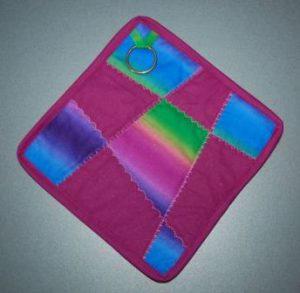 Grydelapper syet med crazy patchwork.